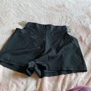 Black shorts with chains on the hips